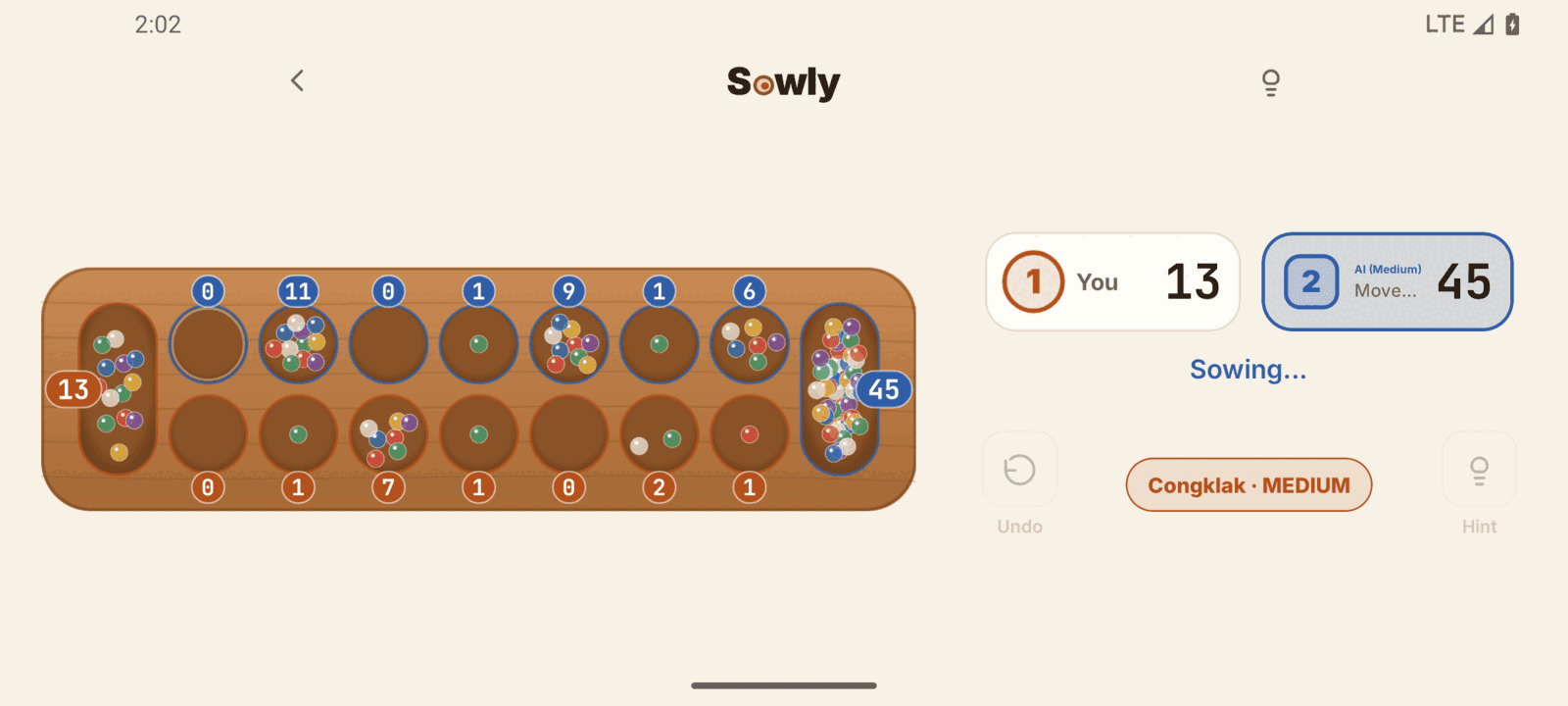 Sowly Congklak game in landscape, with the board on the left and the scores on the right